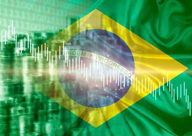 Gráficos de negociação de criptomoedas do Brasil sobre a bandeira brasileira